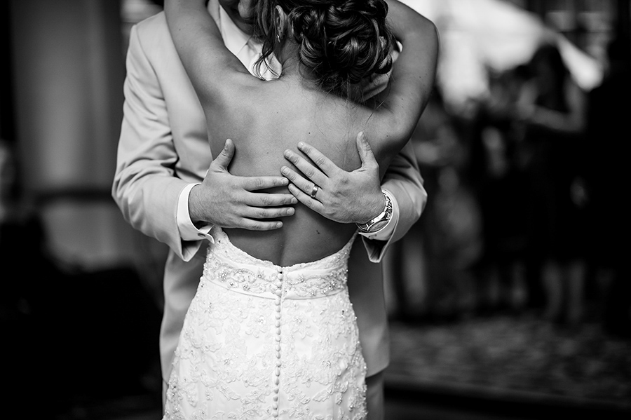 The couple embraces during their first dance.