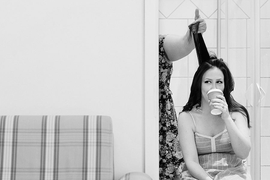 Bride getting her hair done on her wedding morning.