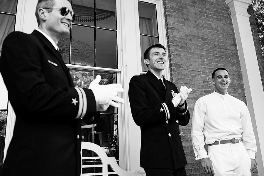 Military groom laughing with his groomsmen.