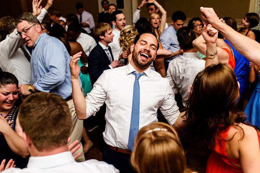 Groom dancing in the middle of all the guests.