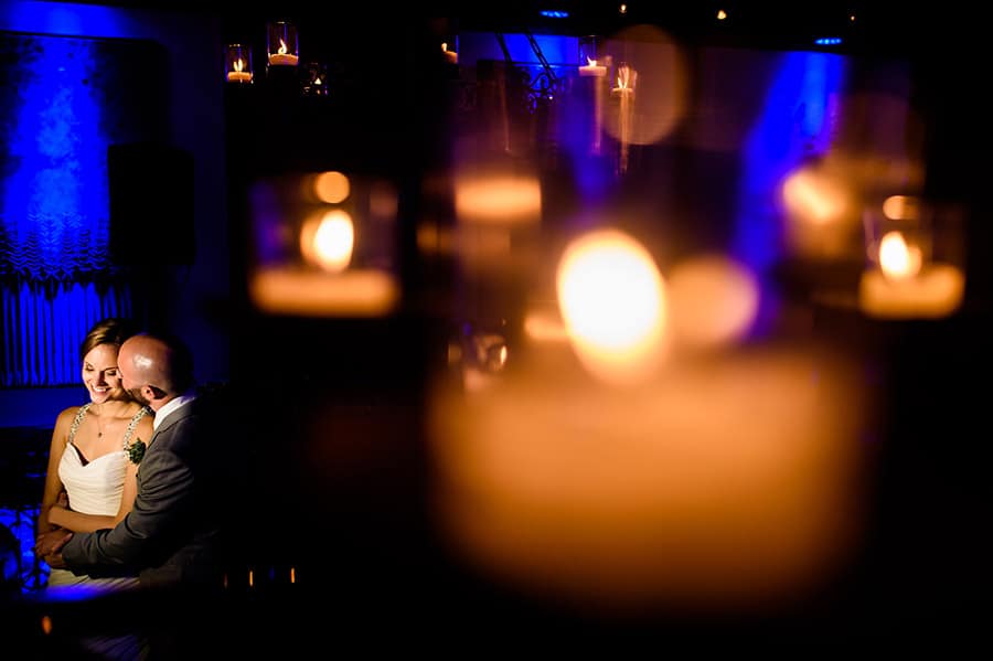 Creative portrait of bride and groom through candles at Artesano Ironworks in Philadelphia