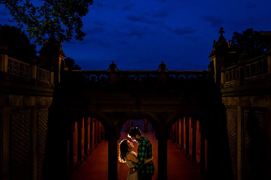 An engaged couple at the Bethesda Fountain during their engagement session.