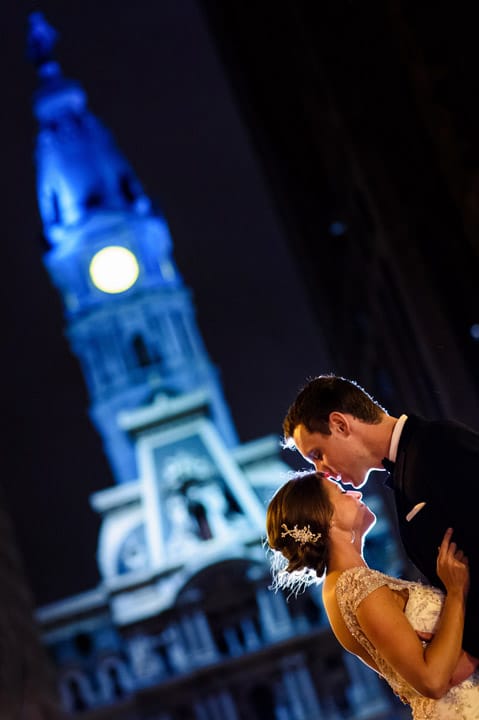 Awesome night portrait of Bride and Groom on Broad St. in Philadelphia in front of City Hall.