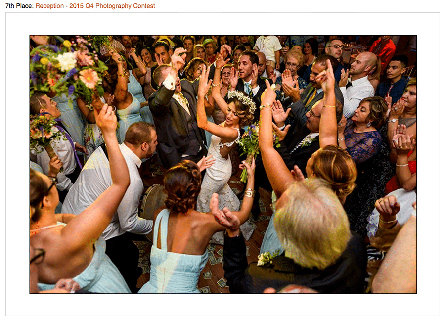 Contest winning photo of bride and groom dancing with wedding guests at Syrian Wedding.