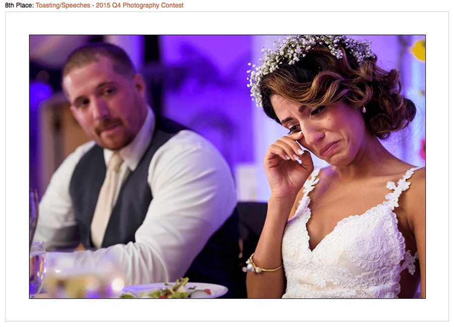 Contest winning photo of bride crying at Maid of honor speech during their wedding reception.