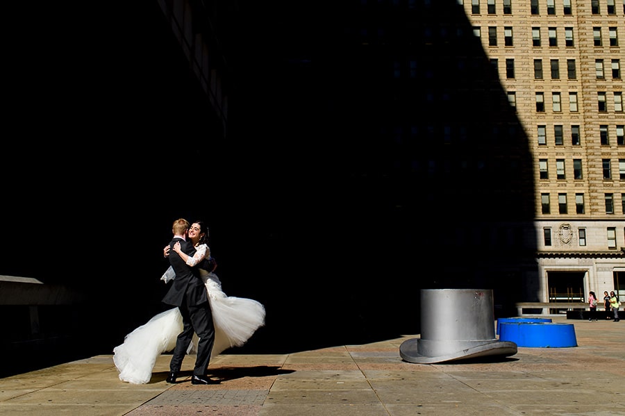 Groom spins bride in Philadelphia Park.
