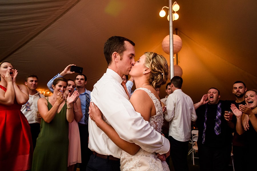 Bride and groom kiss at the end of their wedding reception in New Jersey.